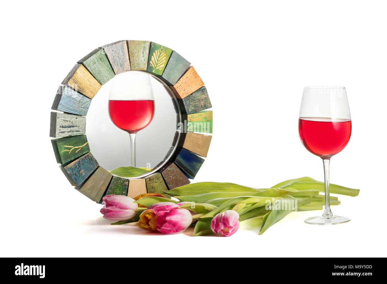 Glass of red rose wine with an inclined horizon reflected correctly in  Handmade Mirror Stock Photo - Alamy