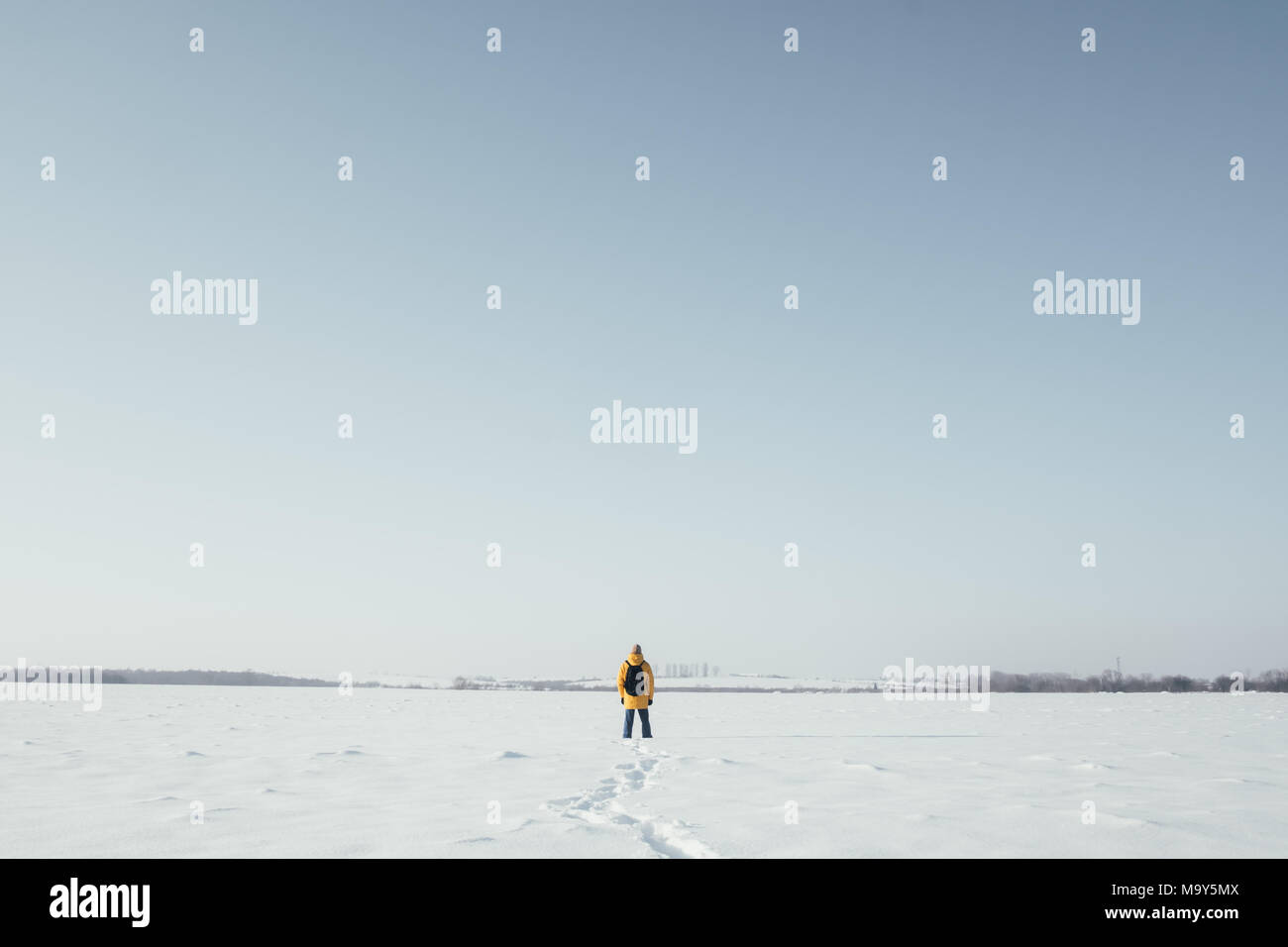 Alone traveler in yellow jacket Stock Photo