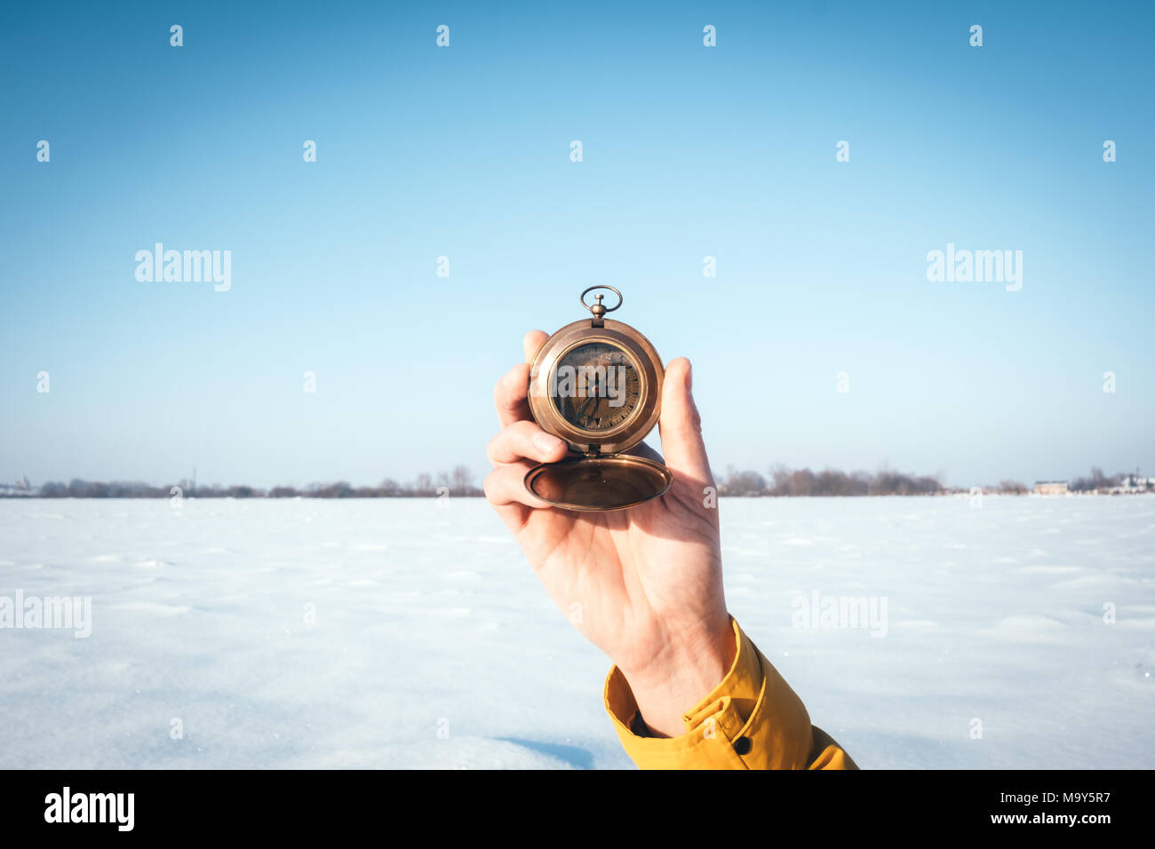 Man with compass in hand Stock Photo