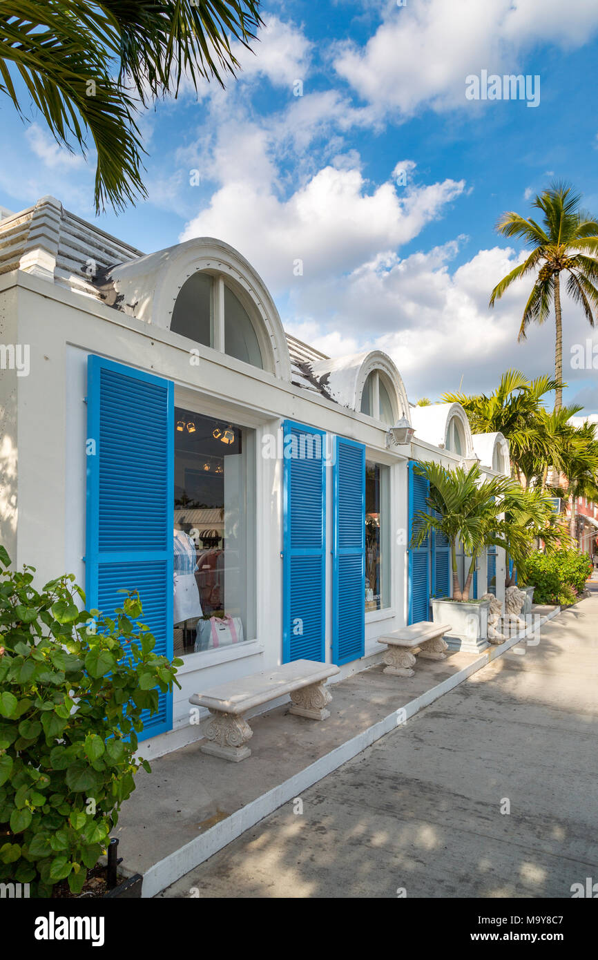 Blue shutters on French-inspired clothing boutique in 3rd Street shopping district, Naples, Florida, USA Stock Photo