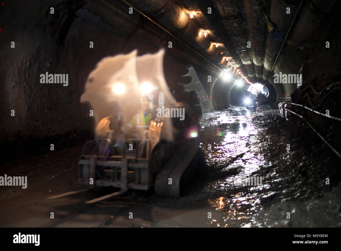 Employees of Technicore Underground construct an underlake pedestrian