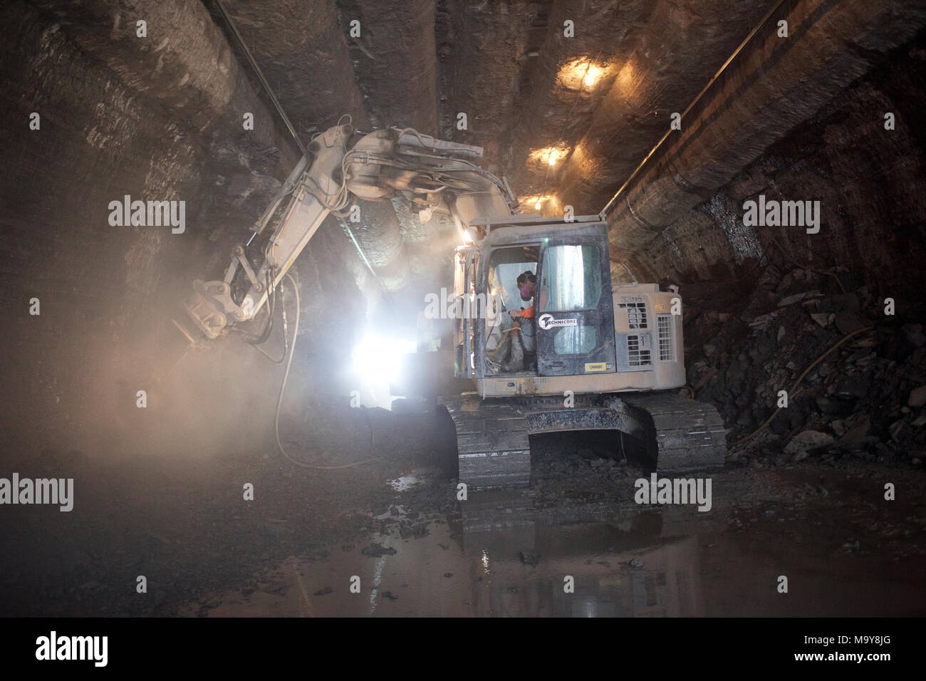 Employees of Technicore Underground construct an underlake pedestrian