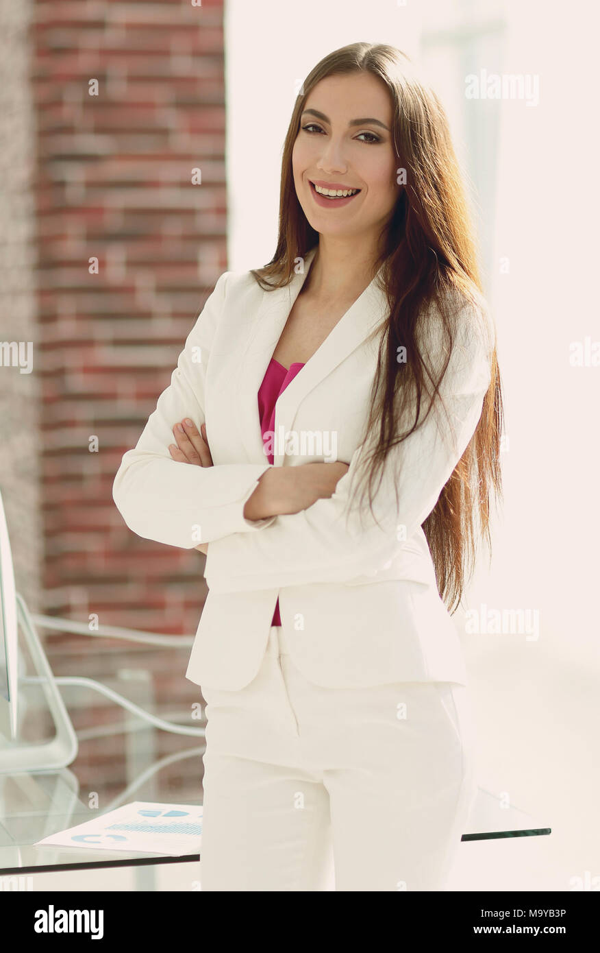elegant business woman in a white business suit Stock Photo - Alamy