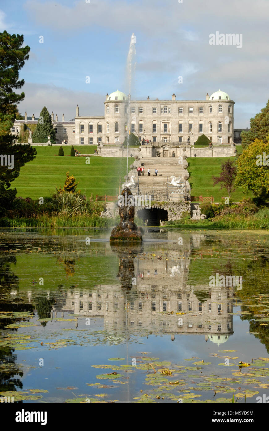 Water reflection of Powerscourt house on the Triton Lake within the