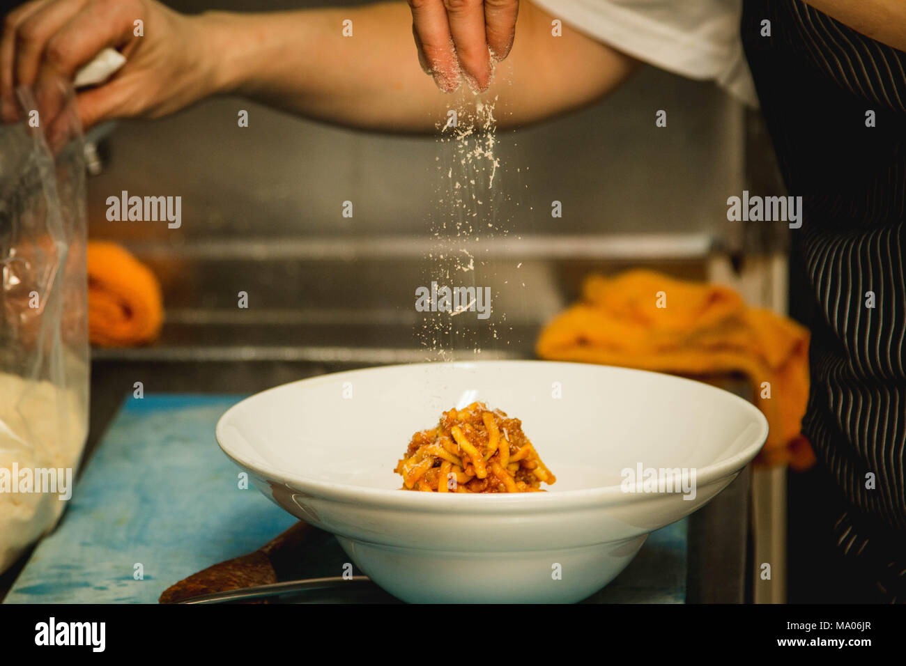 Kitchen moment of serving homemade pasta to a guest Stock Photo Alamy