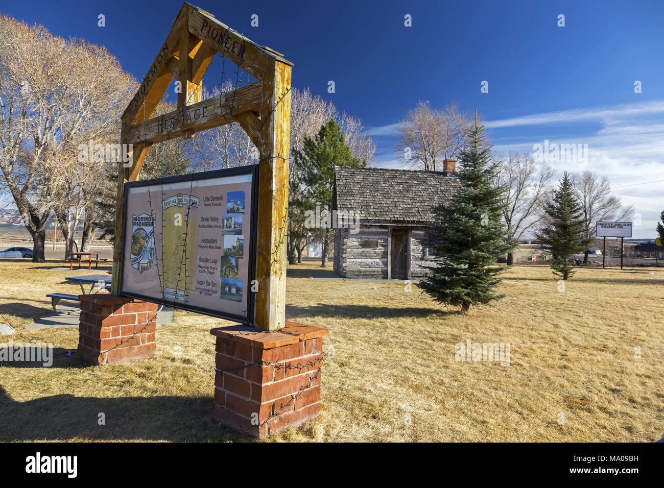 Sign Table In Front Of Old Wild West Log Cabin In Mormon Pioneer