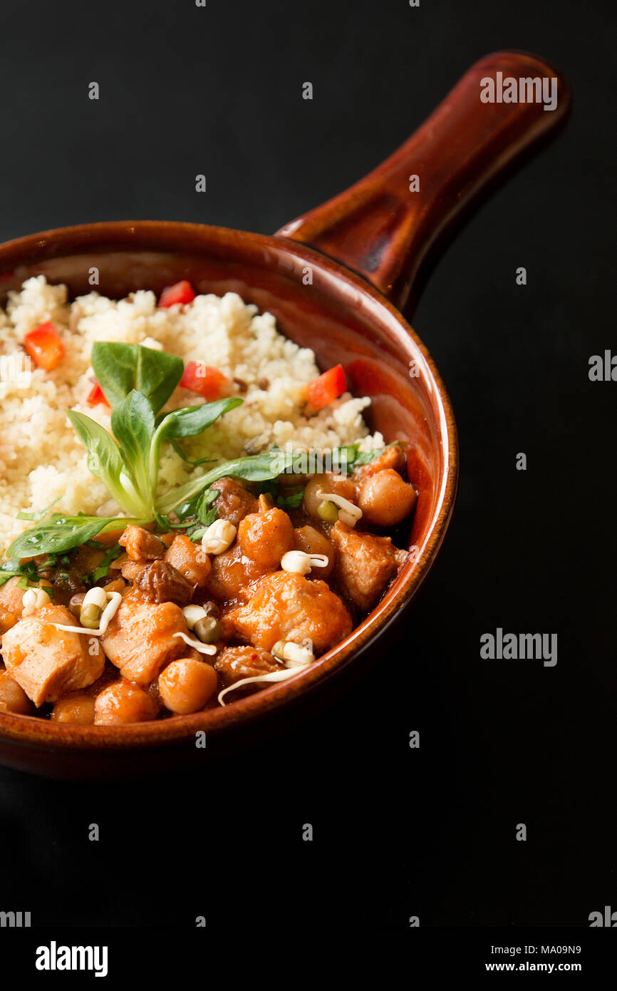 Close up of a Tajine, Morocco meal on a black background Stock Photo - Alamy