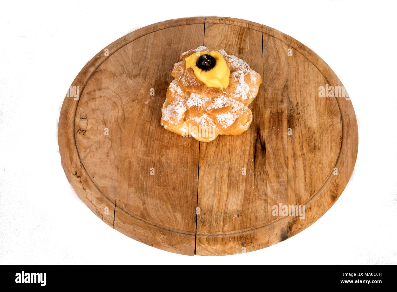 Saint Joseph's Zeppole composition in display on a wooden plate Stock Photo