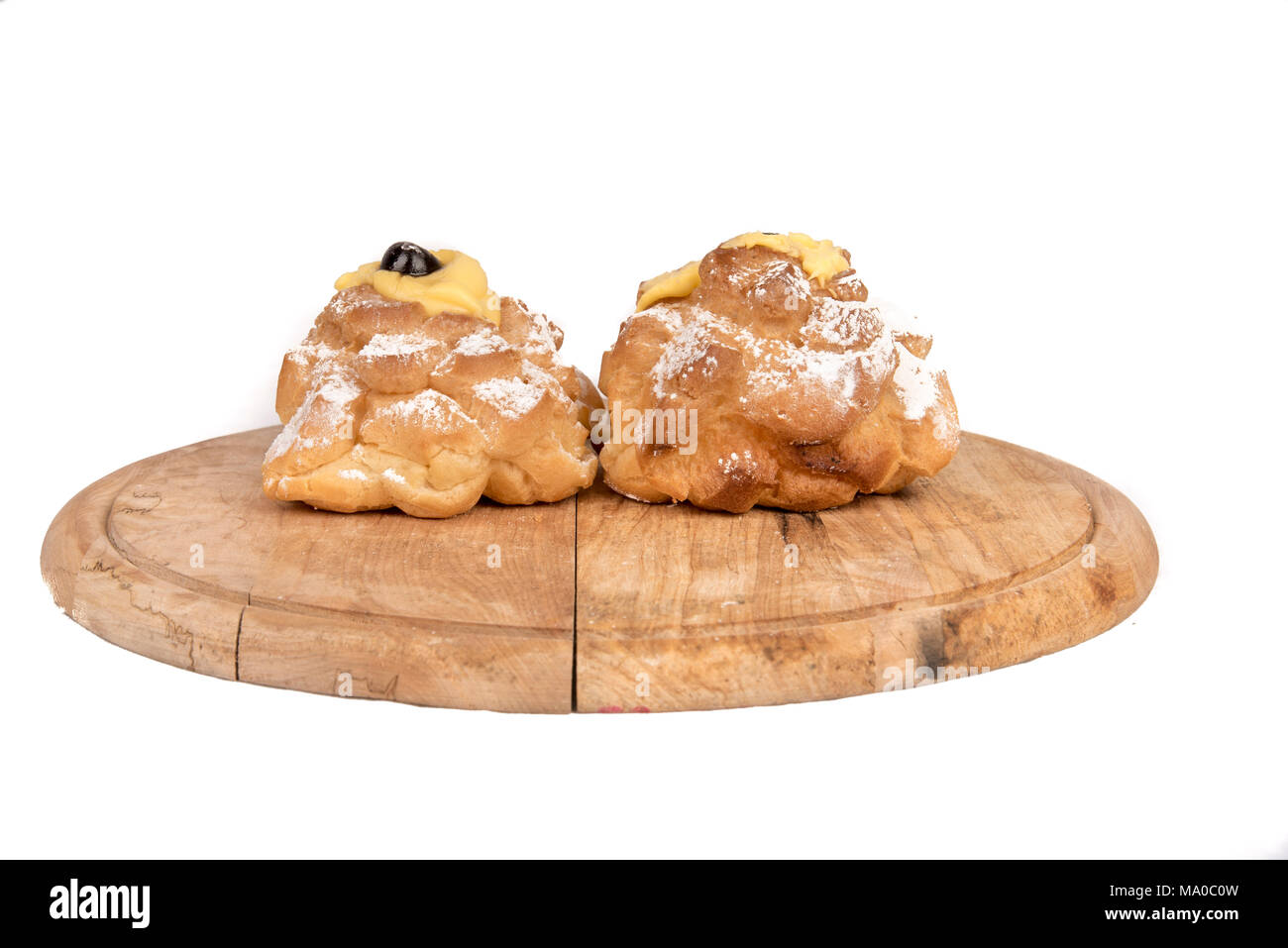 Saint Joseph's Zeppole composition in display on a wooden plate Stock Photo