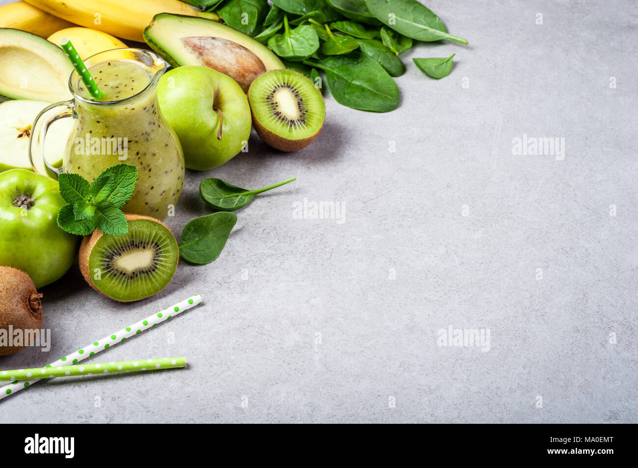 Healthy detox smoothie with kiwi, avocado, banana, apple and spinach