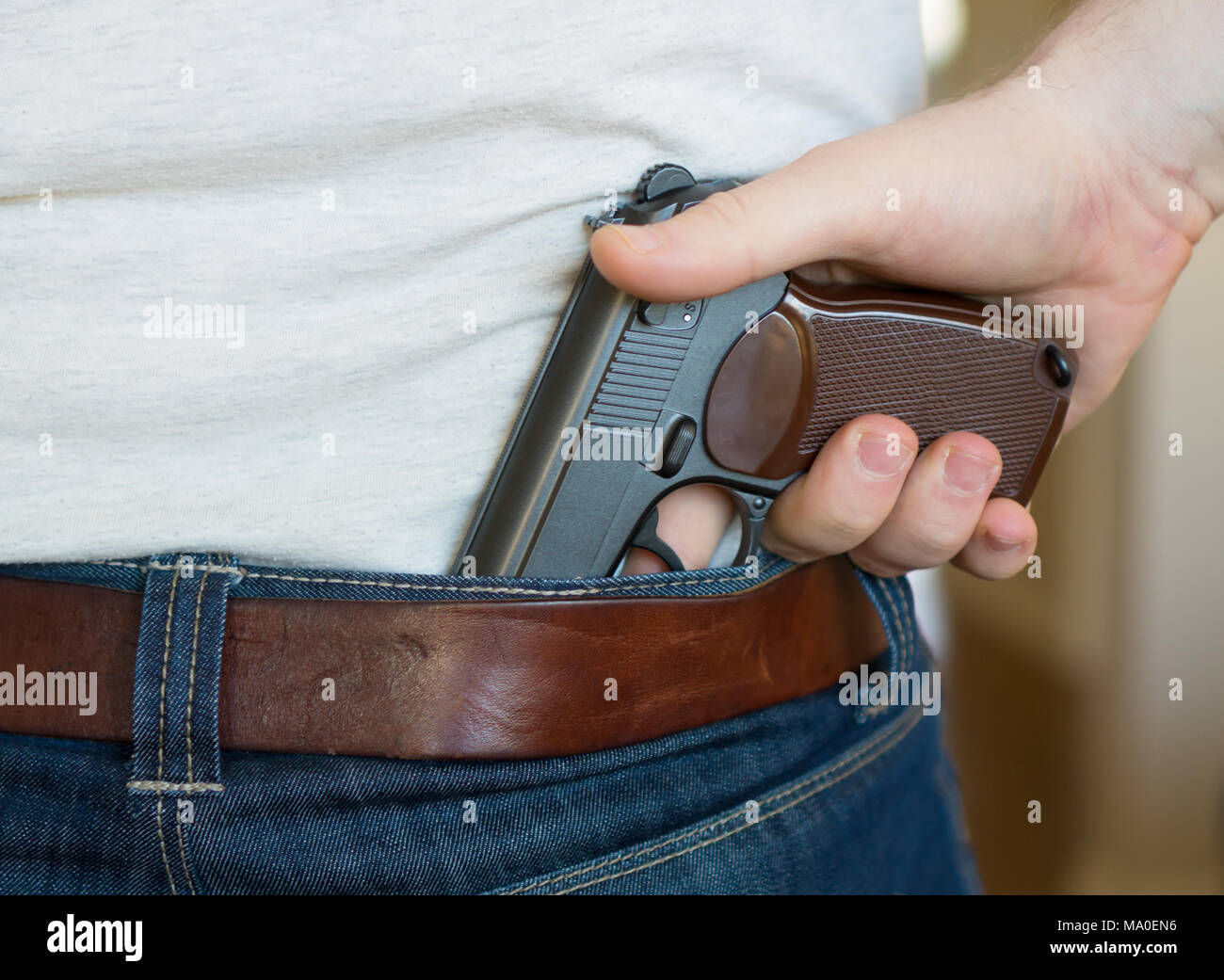 Man backside with weapon hires stock photography and images Alamy