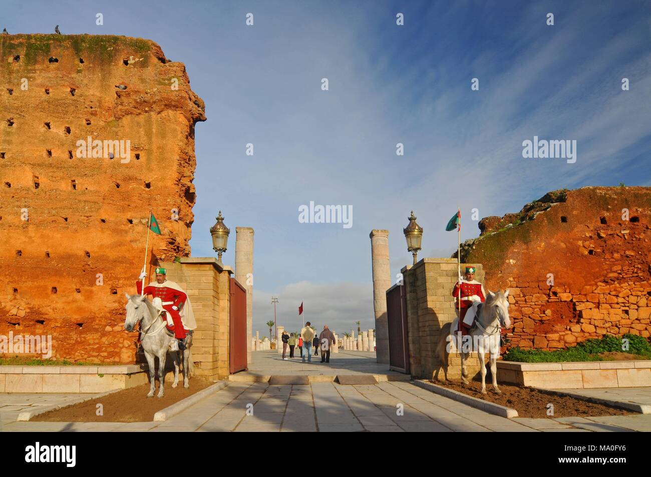 Royal guard in front of Hassan Tower and Mausoleum of Mohammed V. Mausoleum contains tombs of late King Hassan II and Prince Abdallah, Rabat Morocco. Stock Photo