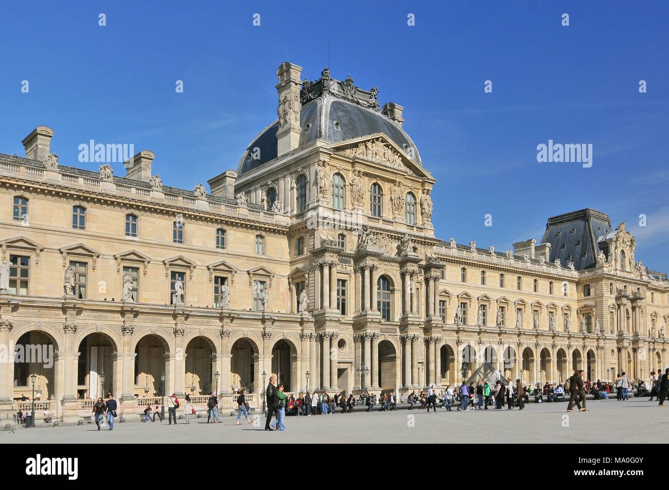 Visitors Outside The Louvre Art Gallery And Museum Paris France