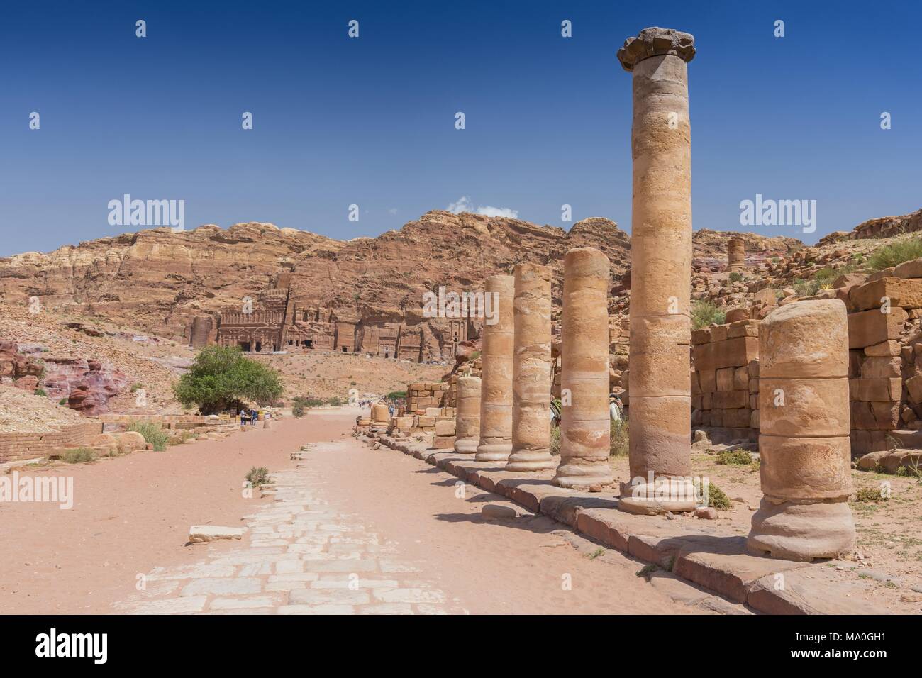 Columns at roman paved road to Qasr al-Bint temple, in Petra Archaeological Park, Jordan. Stock Photo
