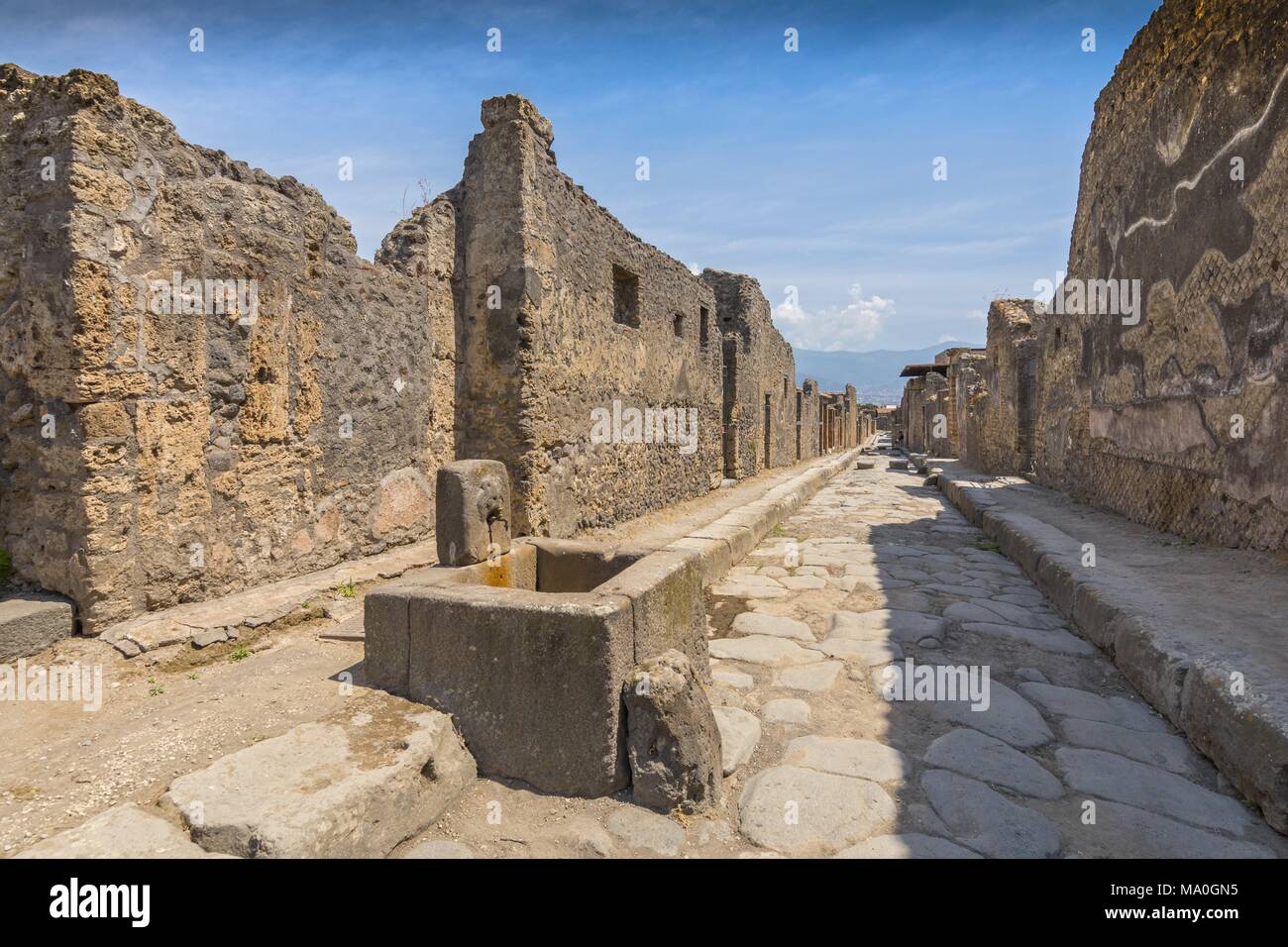 An Ancient Cobbled Street In The Ruins Of Pompeii, Italy Stock Photo ...