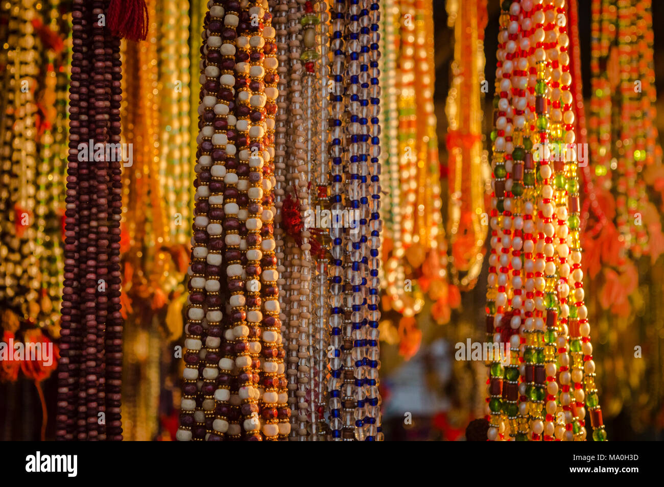 Colourful beads on sale by a street vendor at Sangam, Allahabad during the Kumbh Mela Stock Photo
