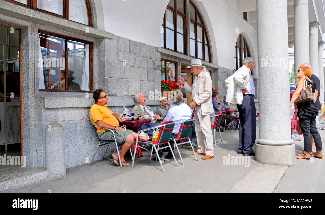Ljubljana, Slovenia. People talking and drinking by the columns of the Plecnik Colonade Stock Photo