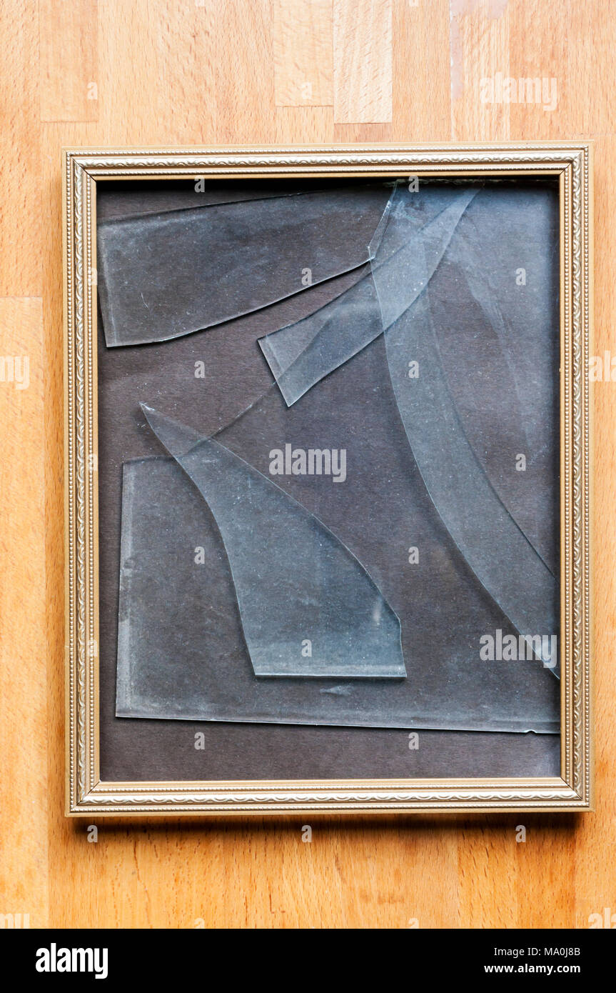 Broken glass in picture frame Stock Photo Alamy