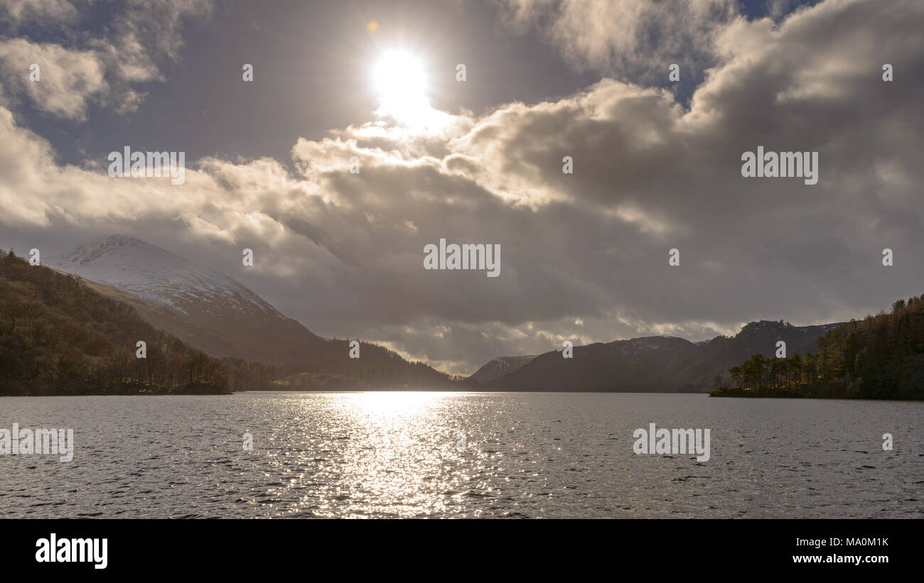 Thirlmere in the Lake District, taken contre-jour a photography technique where you shoot towards the main light source, in this case the sun. It's a  Stock Photo