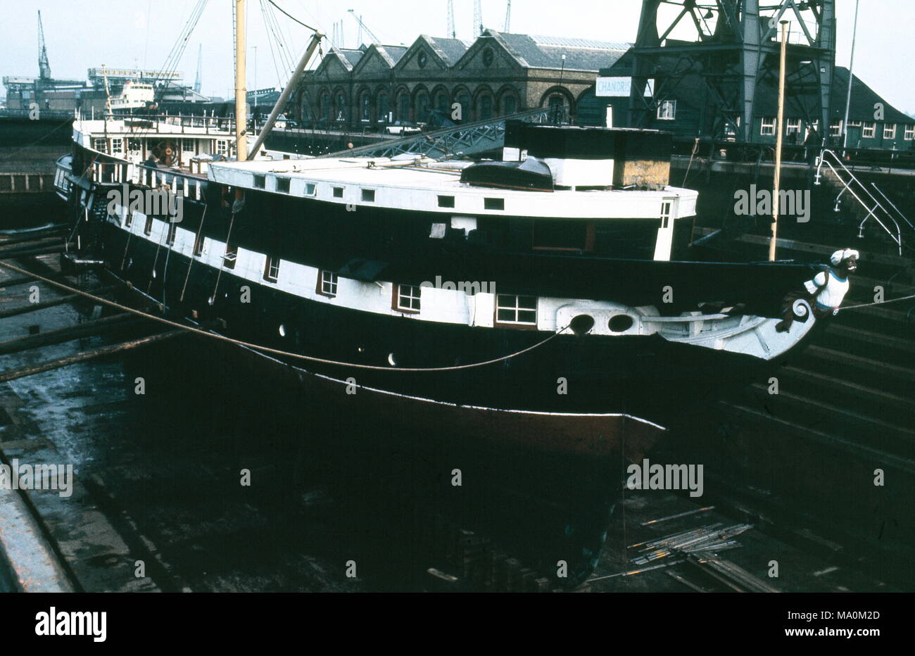 AJAXNETPHOTO. - 16TH FEBRUARY, 1972. SOUTHAMPTON, ENGLAND. - WOODEN WALL REFIT -  T.S. FOUDROYANT (EX TRINCOMALEE) UNDERGOING REPAIRS IN NR. 5 DRY DOCK.  PHOTO:JONATHAN EASTLAND/AJAX REF:357205 3 Stock Photo