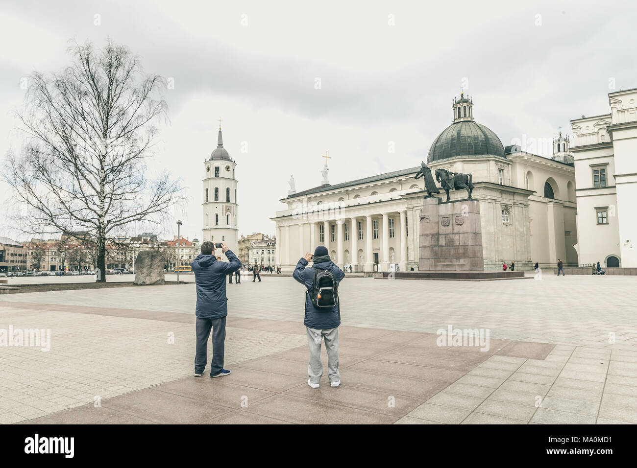 People walking on  Cathedral square with bell tower in  Vilnius  Stock Photo