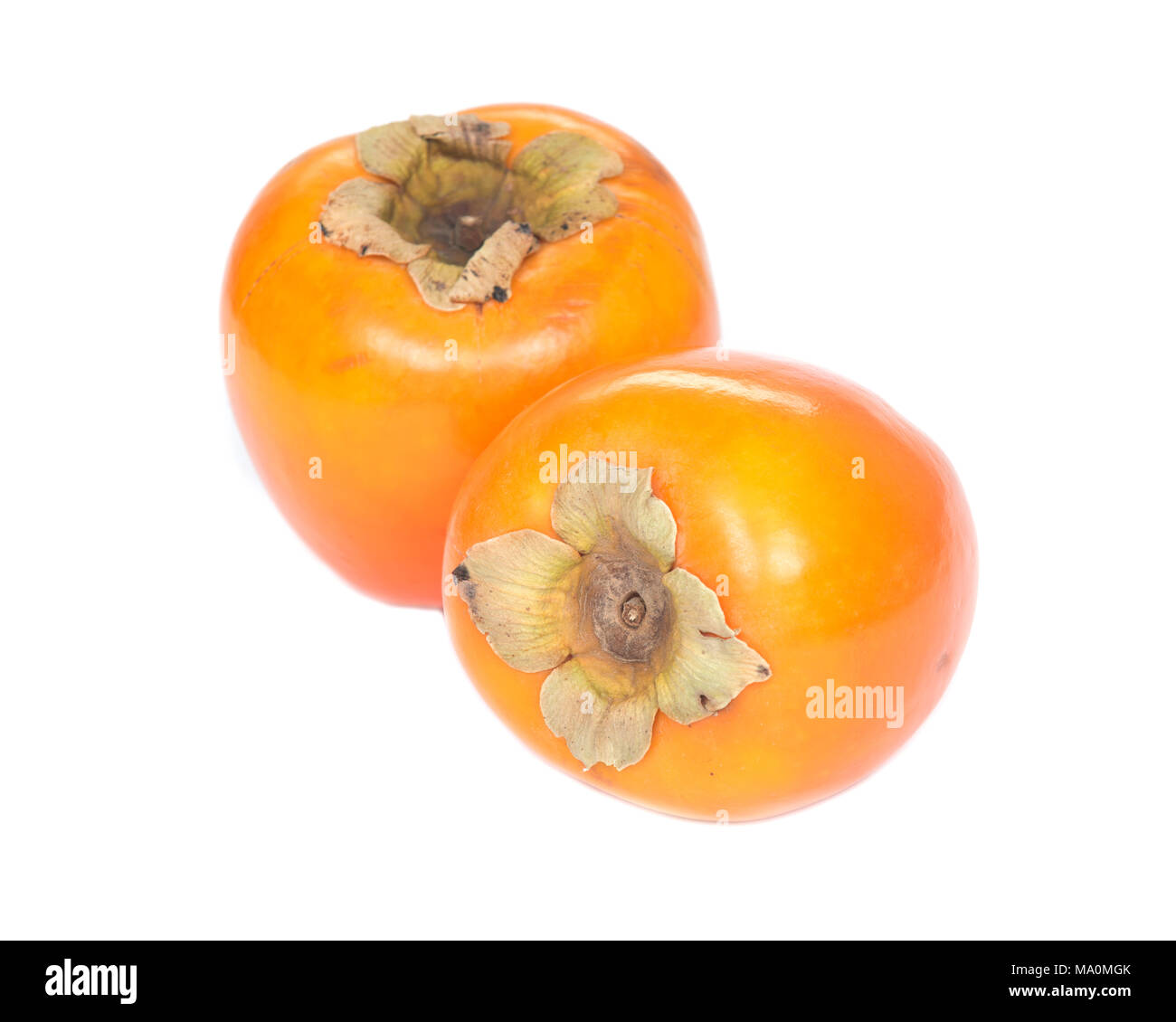 Two fresh organic persimmons isolated on white background Stock Photo