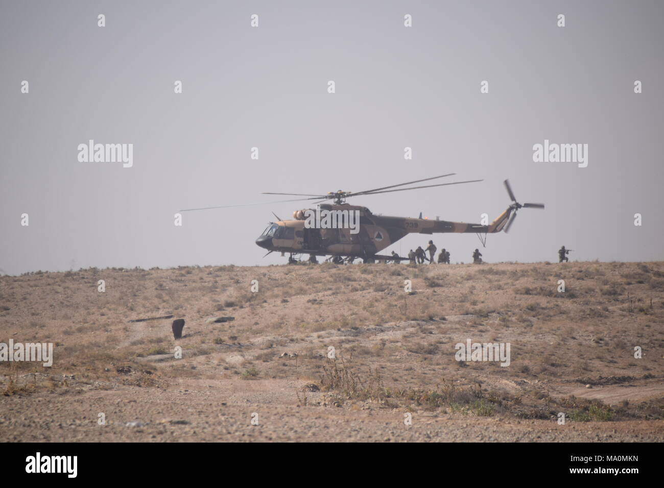 Afghan soldiers disembark from a Mi-17 transport helicopter of the Afghan Air Force during an exercise in the Kabul Military Training Centre (KMTC). Stock Photo