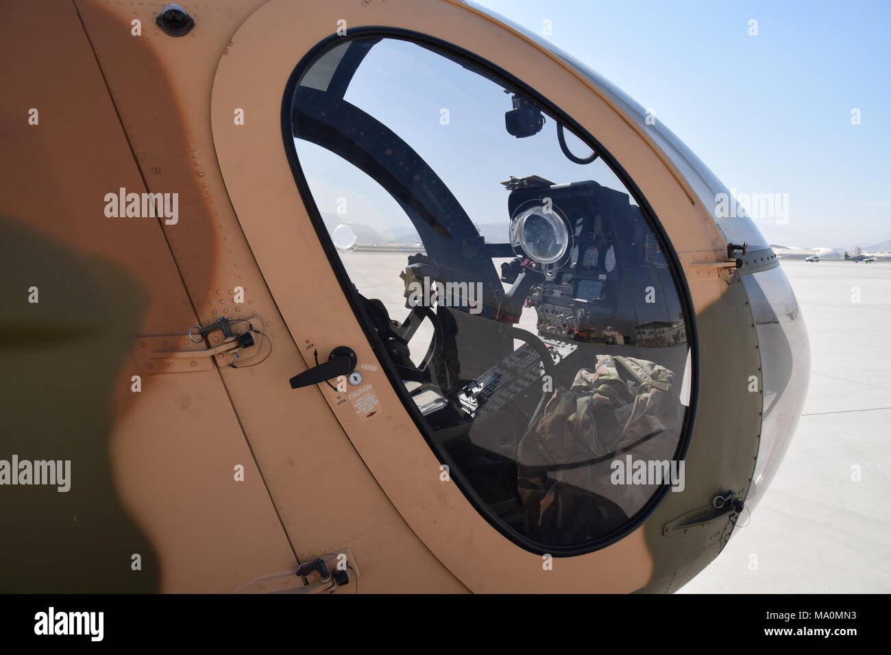 Nose and cockpit of a MD 530F Cayuse Warrior light attack helicopter of the Afghan Air Force, Kabul Military Airport. Stock Photo