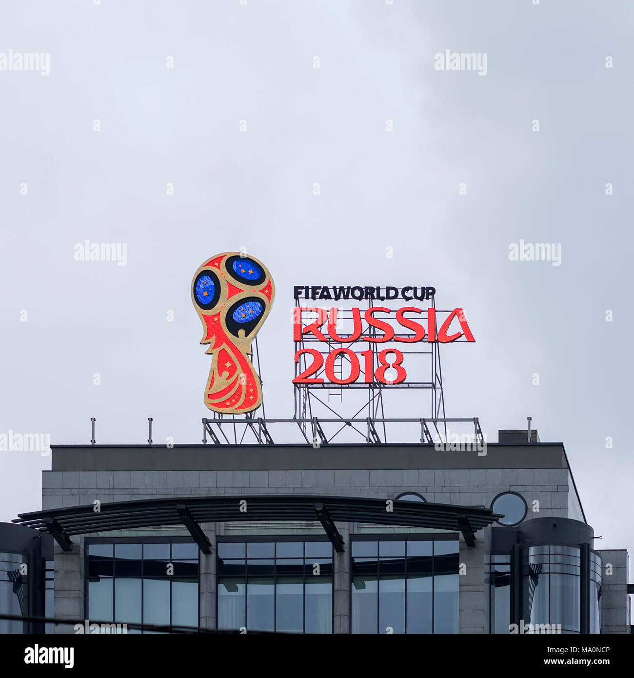 MOSCOW, RUSSIA - OCTOBER 28, 2017 Official emblem, logo of the 2018 World Cup on the roof of building on one of the capital's street against the sky Stock Photo