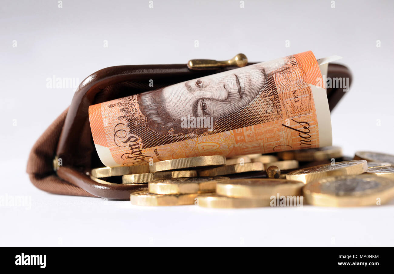 PURSE WITH BRITISH NEW £10 NOTE AND ONE POUND COINS RE THE ECONOMY SPENDING DISPOSABLE INCOME ETC UK Stock Photo