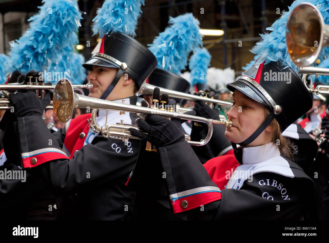 Girl & boy playing trumpets in St. Patrick's Day Parade in New York