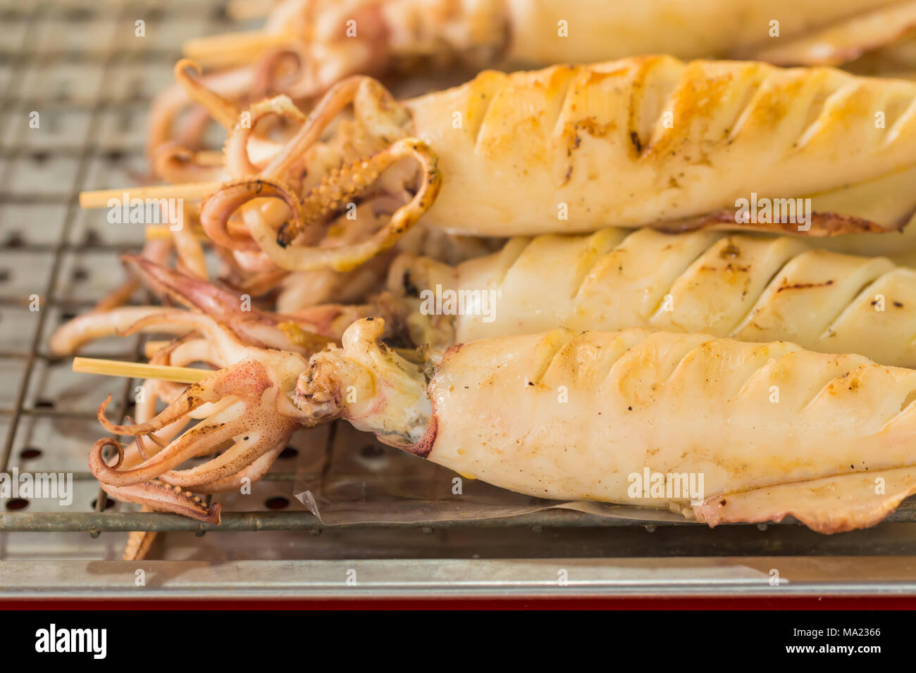 Grilled octopus skewers in Thaialnd maket Stock Photo Alamy