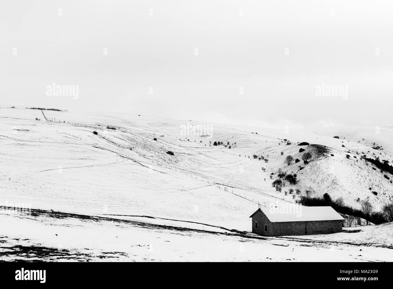 A small mountain retreat covered by snow on Mt. Subasio (Umbria, Italy), during winter season Stock Photo