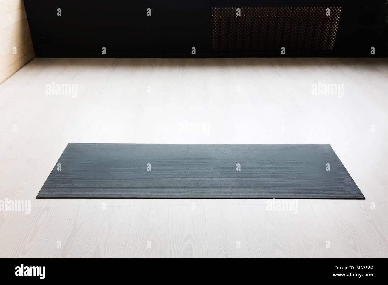 Empty yoga mat on the floor Stock Photo Alamy