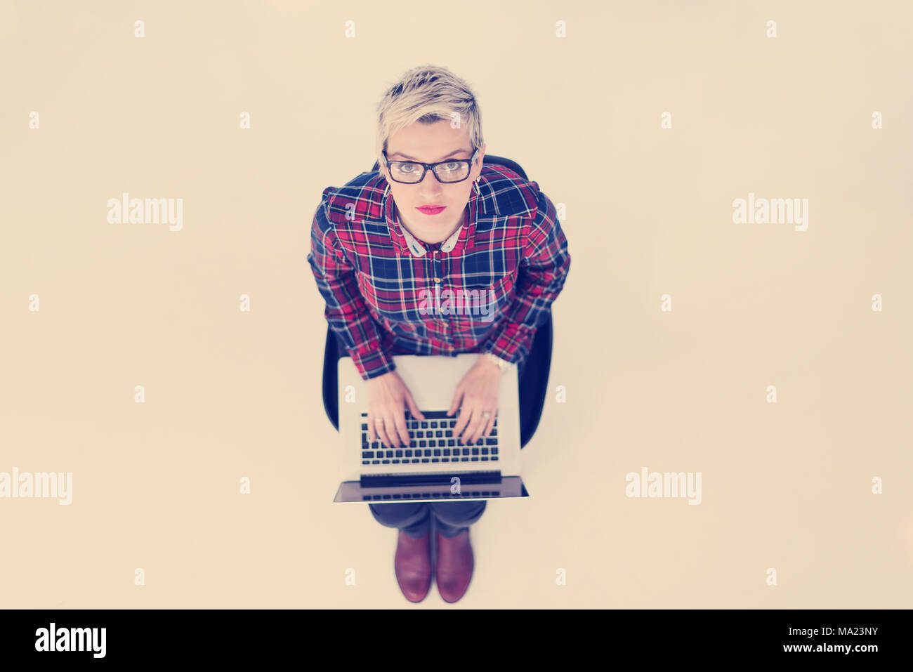 top view of young business woman working on laptop computer in modern ...