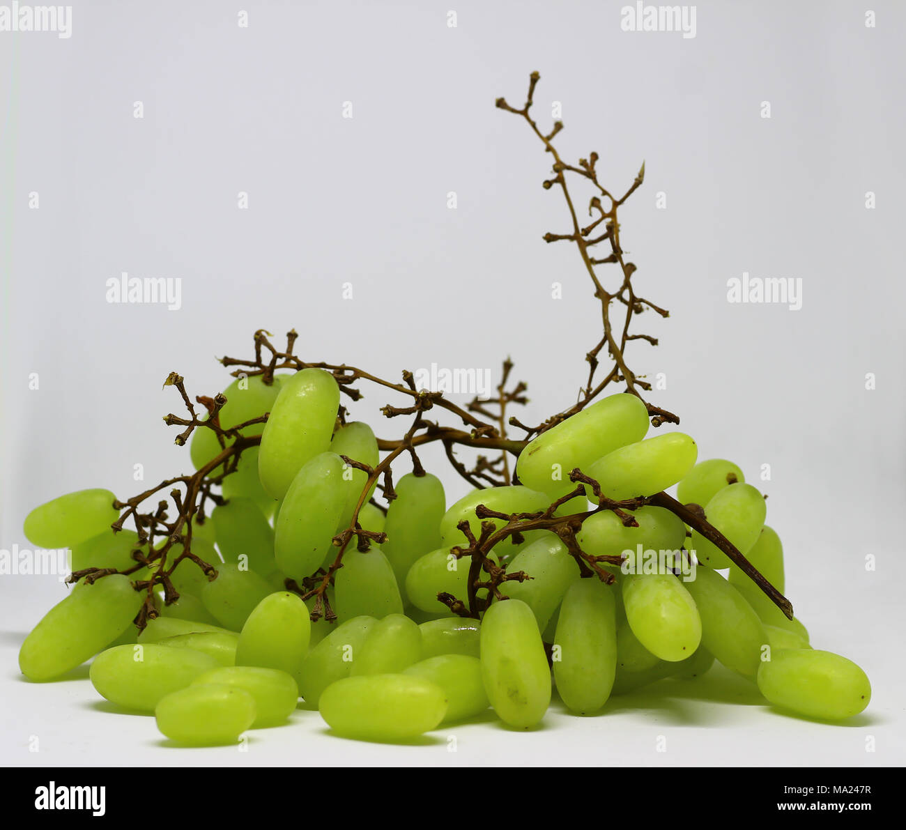 Green grape with branches isolated on white. With clipping path. Full ...