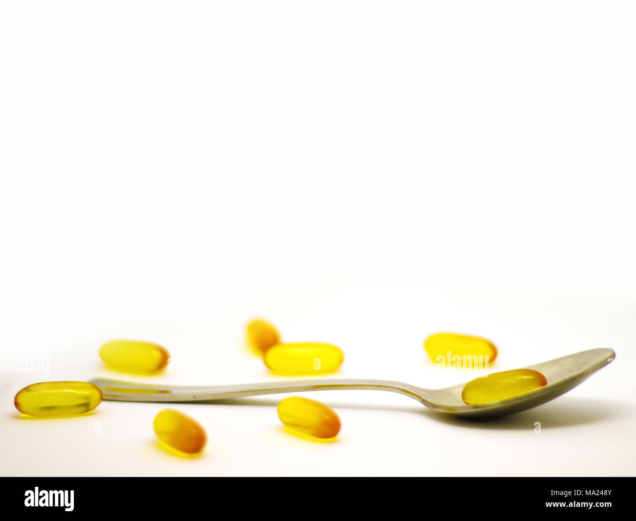 cod liver oil omega 3 vitamin e gel capsules isolated on white