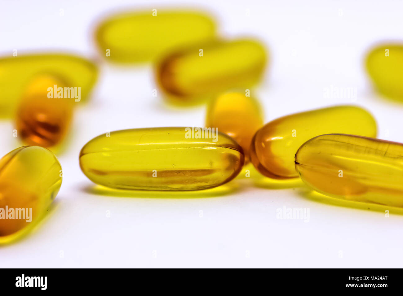 Cod liver oil omega 3 vitamin e gel capsules isolated on white