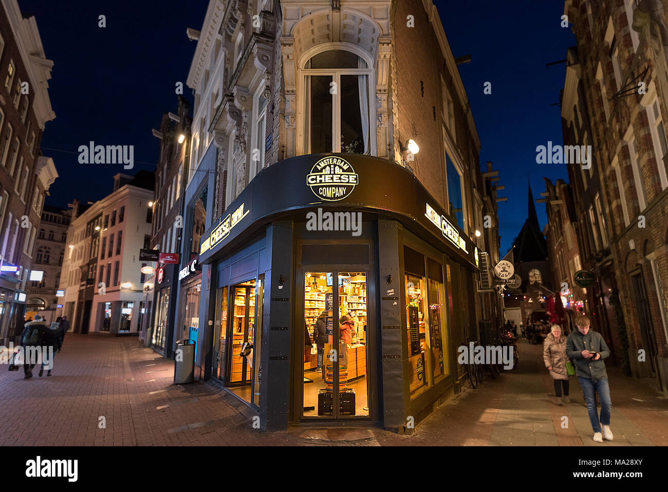 An interesting corner location shop of the Amsterdam Cheese Company on a pedestrianised street in Amsterdam, Netherlands. Stock Photo