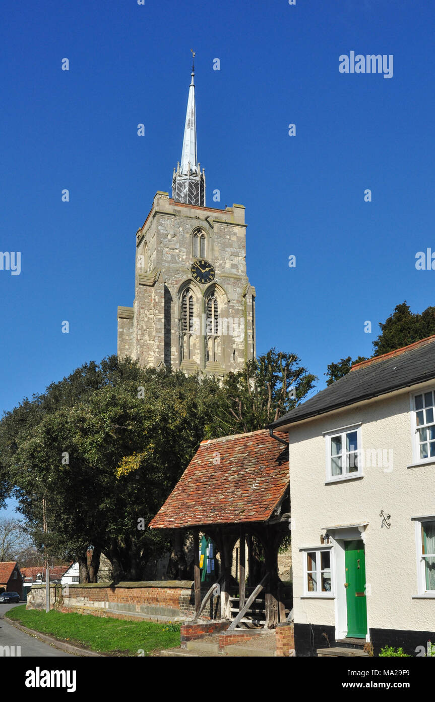 The tower of St Mary's Church behind houses in Mill Street, Ashwell