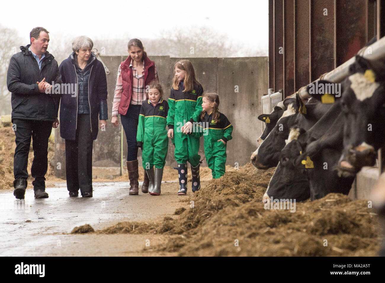 Prime Minister Theresa May is shown around Fairview Farm by owners Stephen and Susanne Jackson and their three daughters Hannah, Abbie and Emily (left to right not given) in Bangor, Northern Ireland during a tour of the four nations of the UK, with a promise to keep the country united one year before Brexit. Stock Photo
