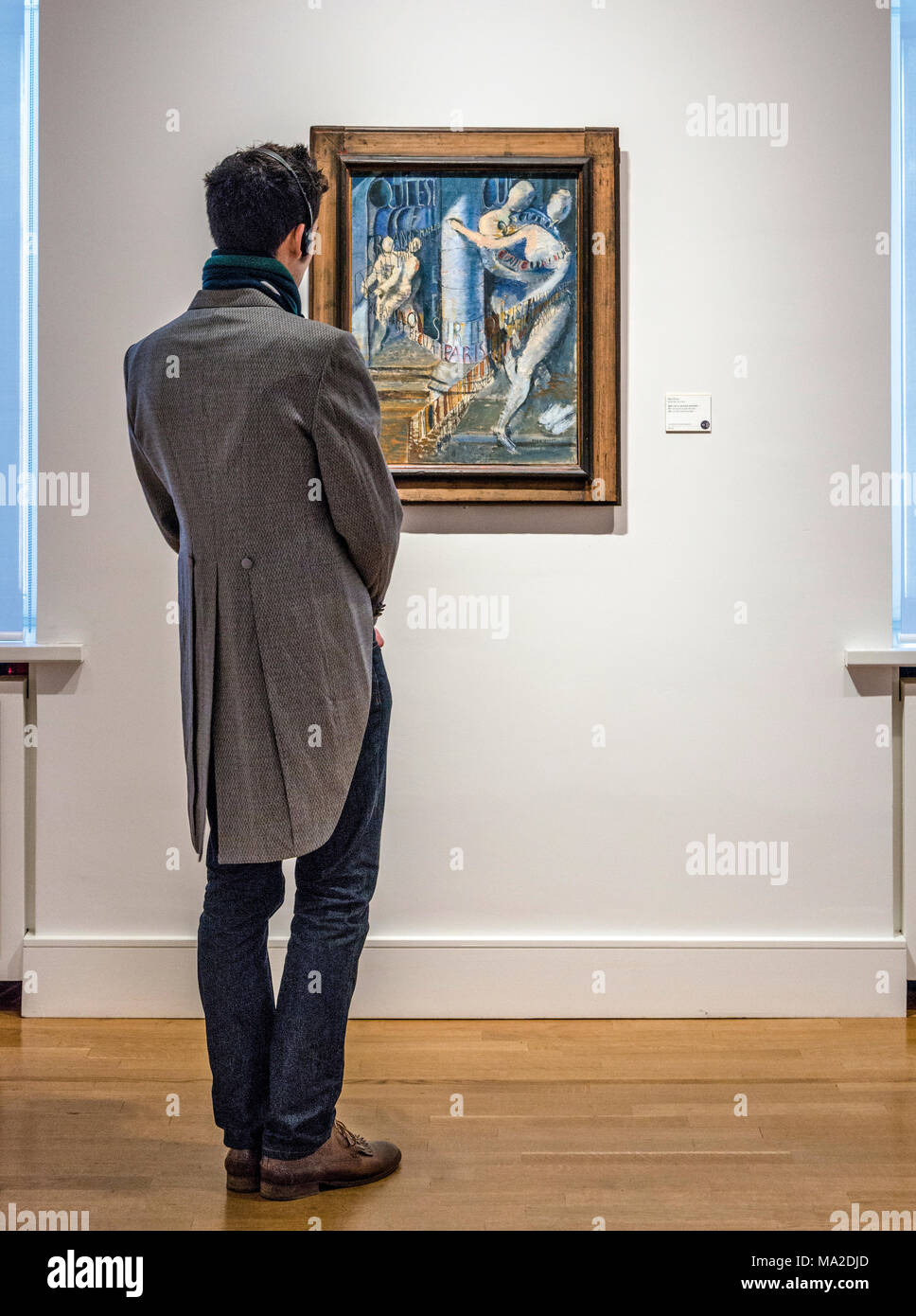 Man looking at painting in Sammlung Scharf Gerstenberg National Museum in Berlin, Germany Stock Photo