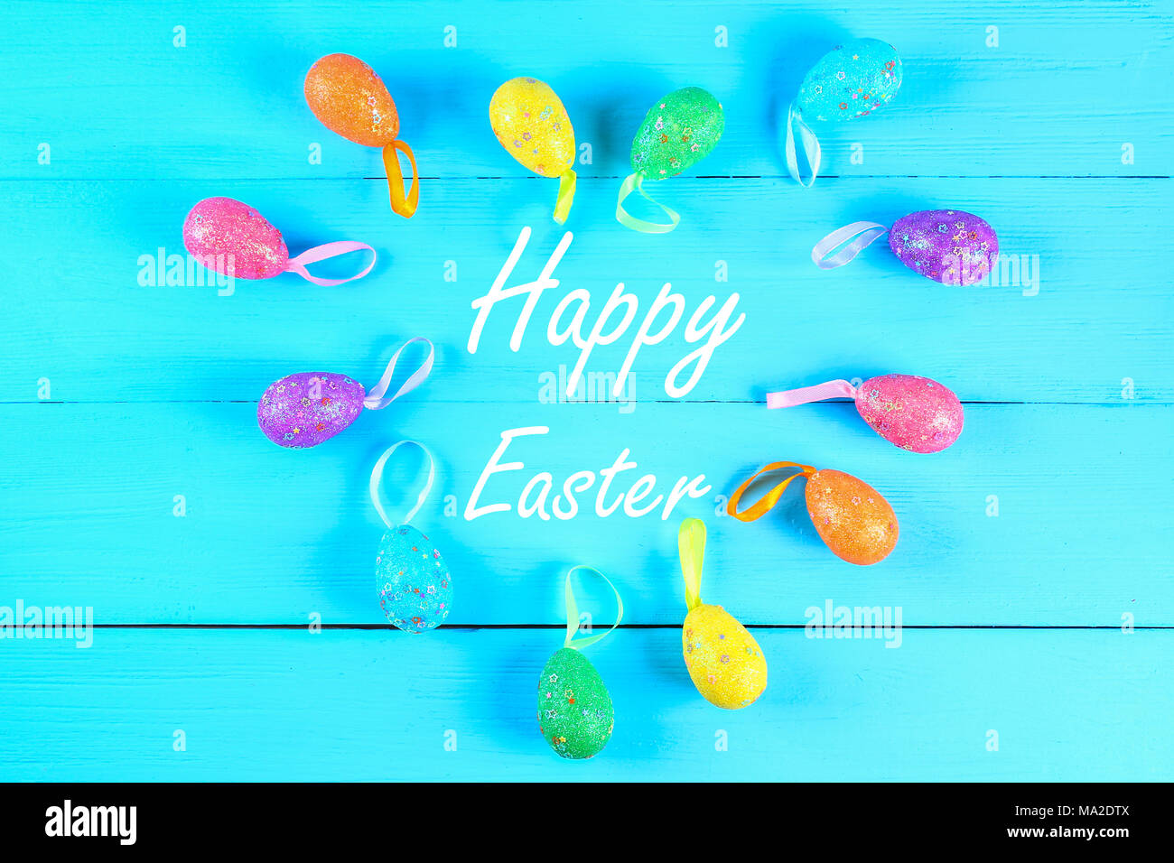 Colorful easter egg on blue pastel color wood background with space. Happy easter Stock Photo
