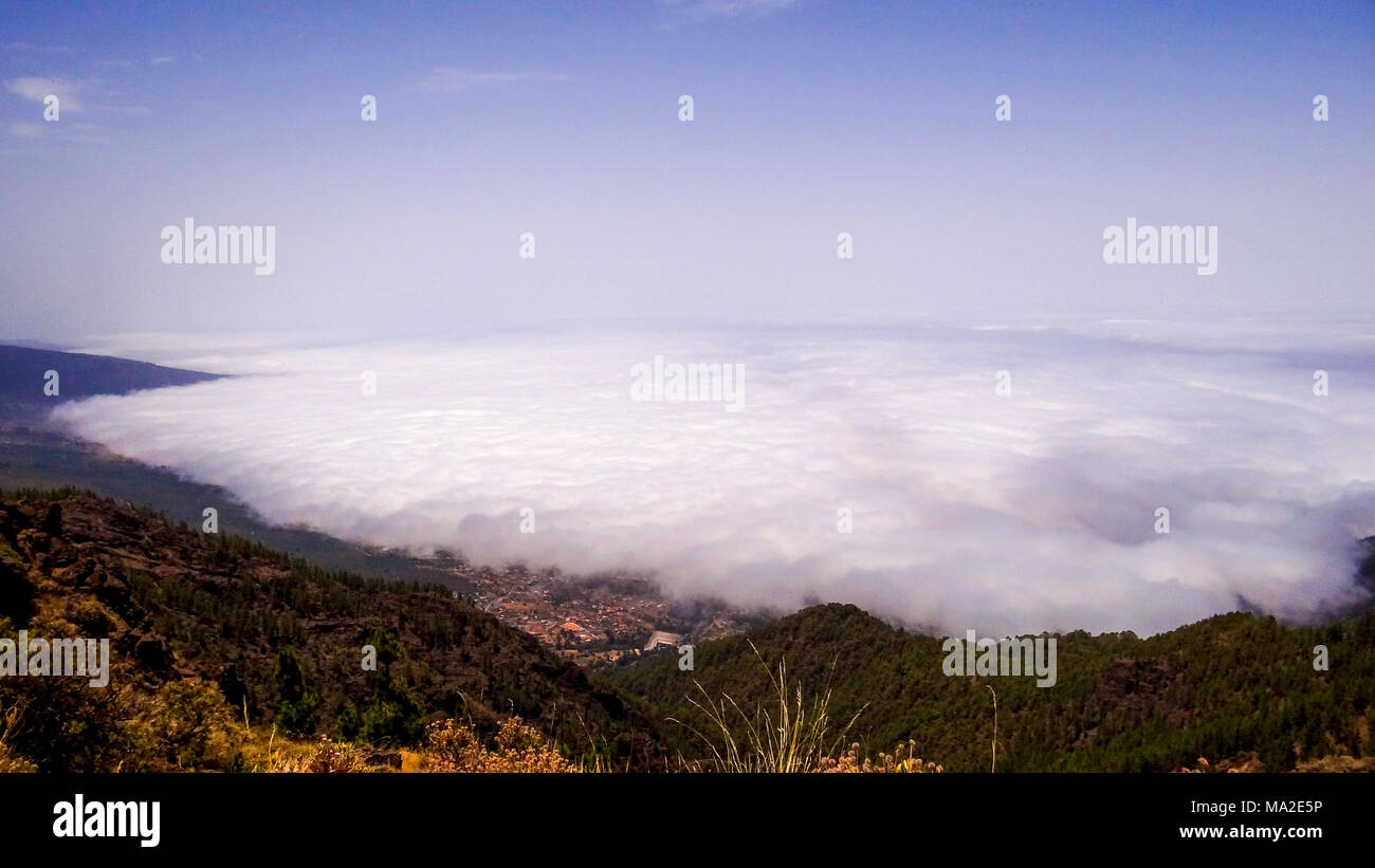 View from mountains of Tenerife, spain, Teide, clouds over the mountains,  beautiful landscape Stock Photo - Alamy