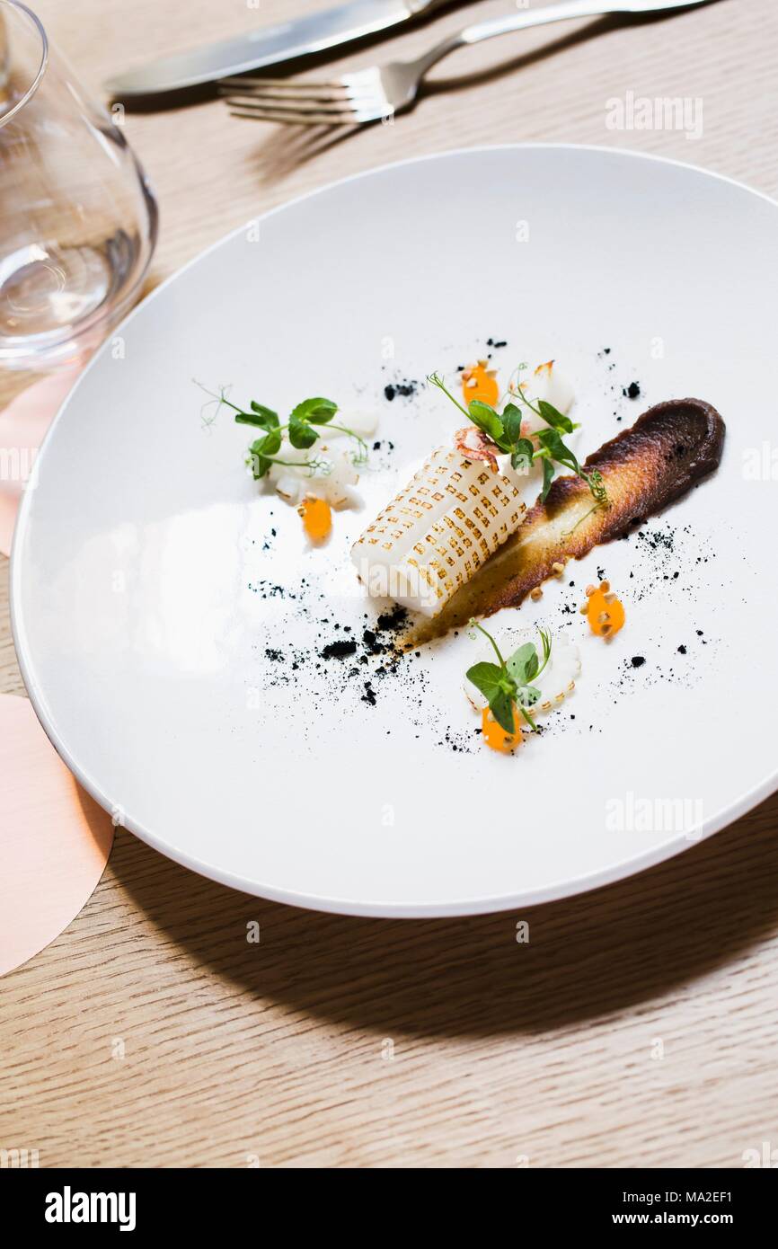 Squid with charred onions at restaurant Porte No. 12, Paris Stock Photo -  Alamy