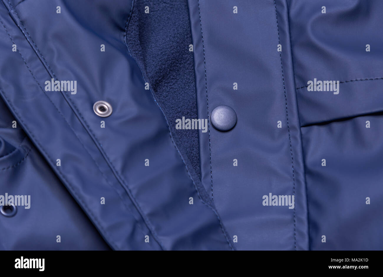 Raincoat unbuttoned closeup. Stock Photo