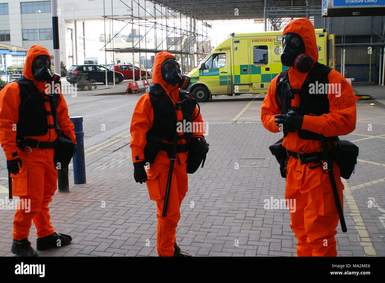 police in CBRN suites protecting hospital during  terrorist chemical and biological attack in a city Stock Photo