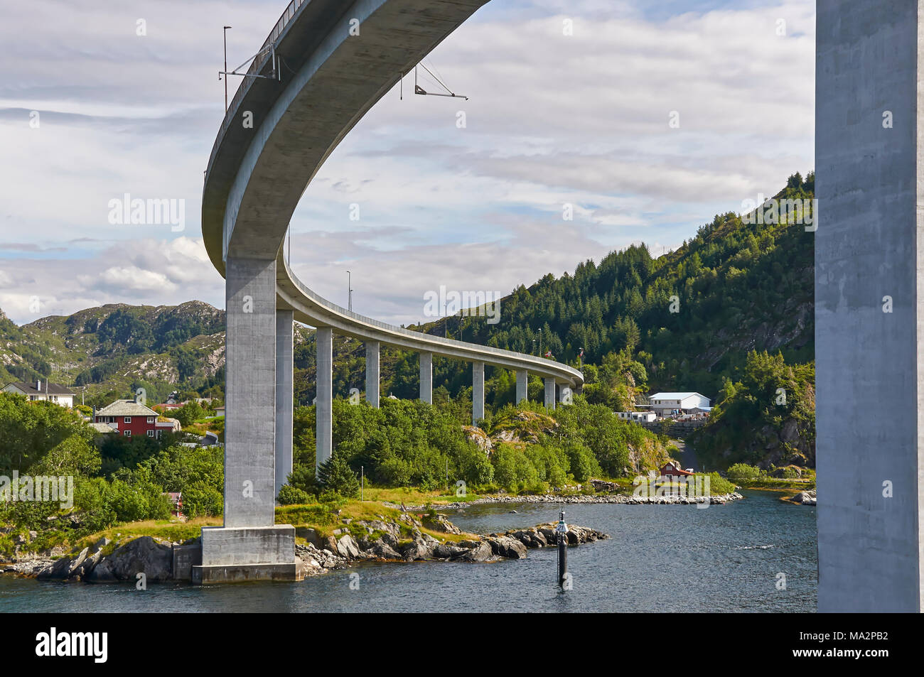 On a Vessel passing under the Maloy Road Bridge which connects the Islands of Maloya and Vagsoy on the Western Coast of Norway, near Bergen. Stock Photo