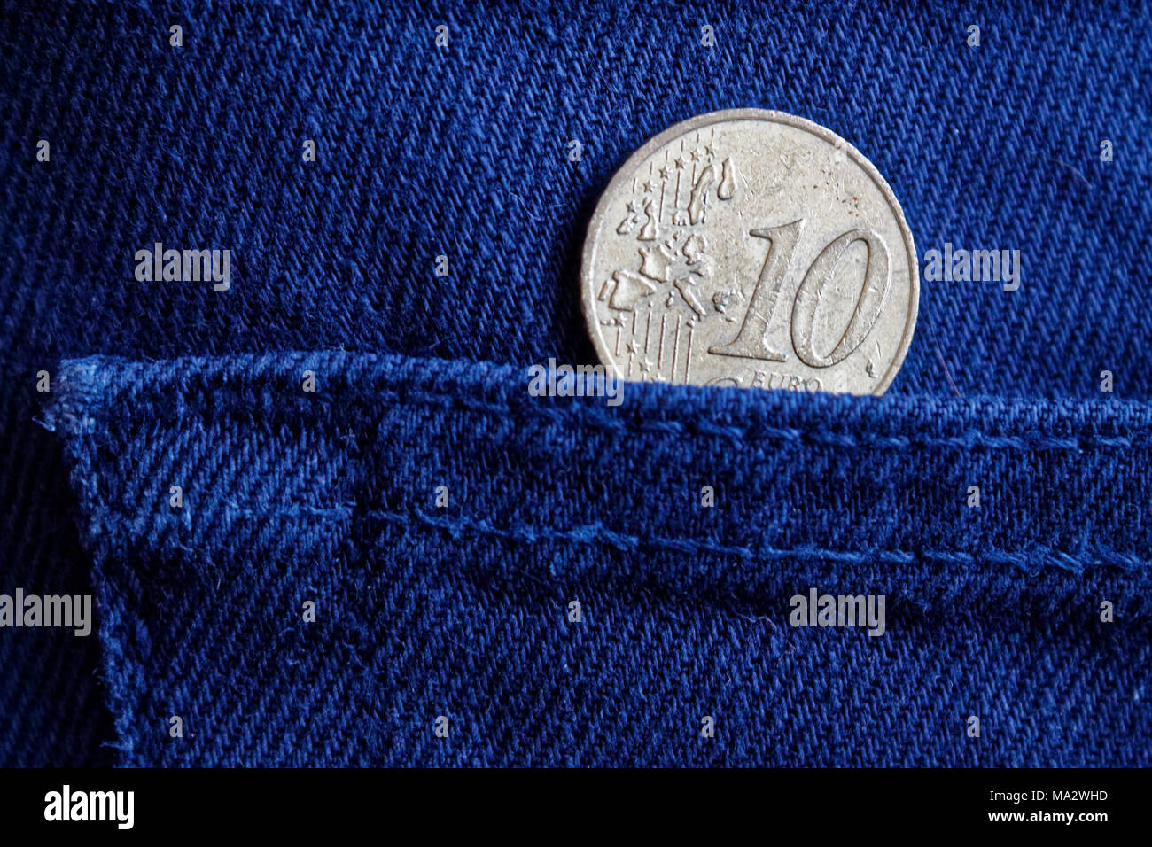 Euro coin with a denomination of 10 euro cent in the pocket of blue denim  jeans Stock Photo - Alamy