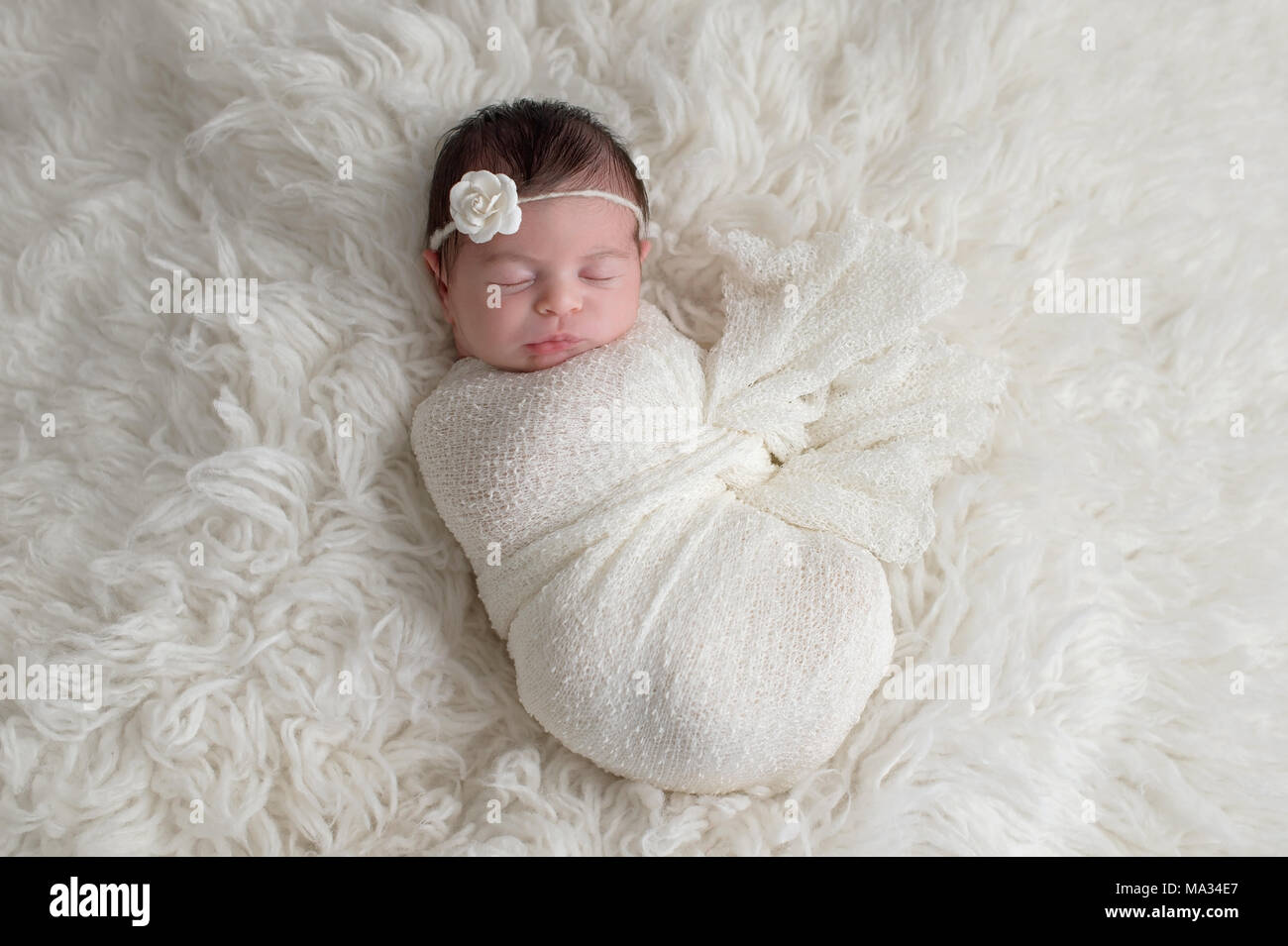 newborn baby girl swaddle